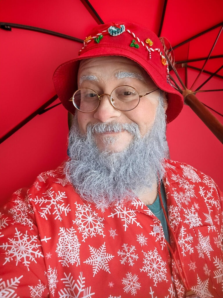 Santa in his summer outfit is one of our favorite Christmas in July party ideas